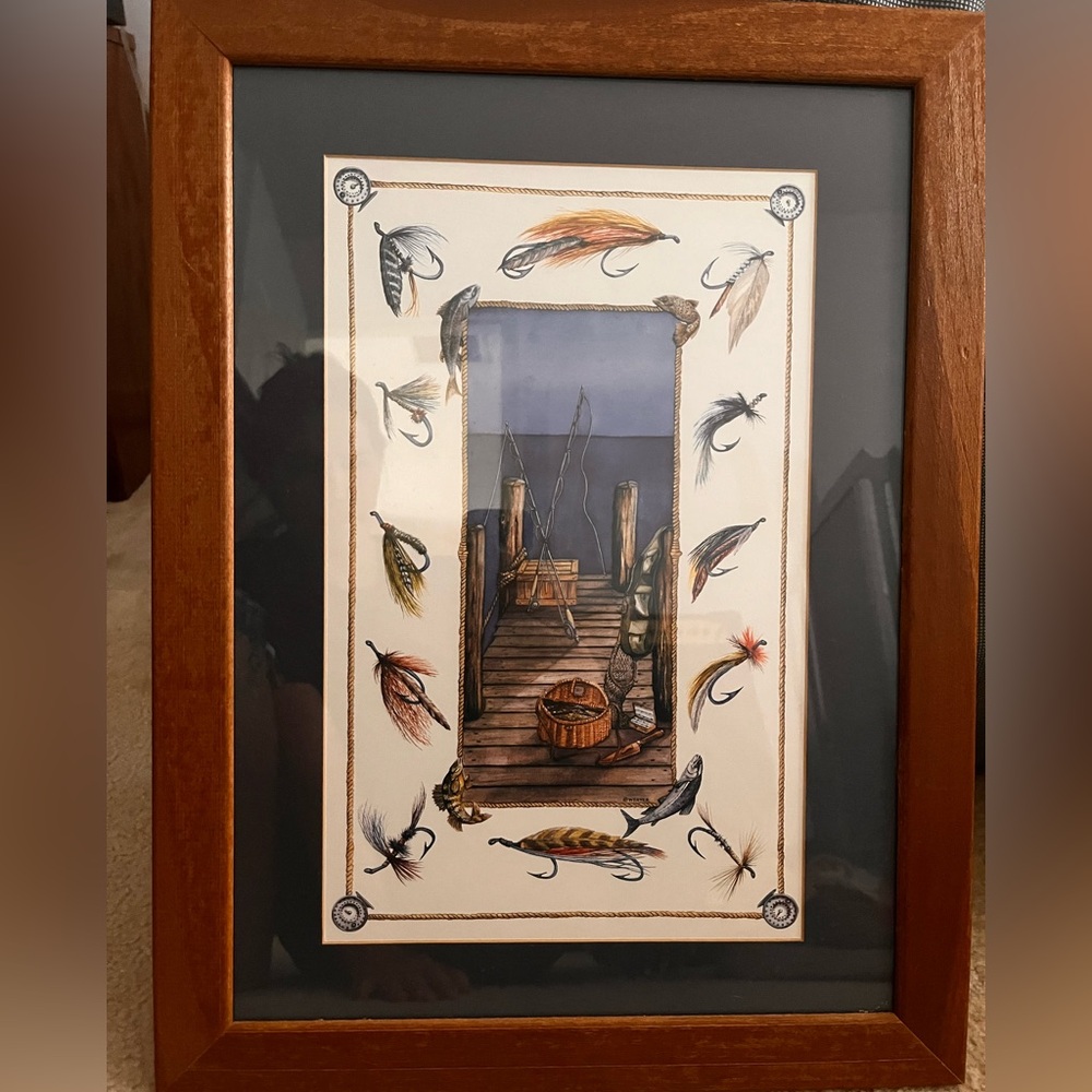Framed fishing art.  Navy blue matte. 16x21”